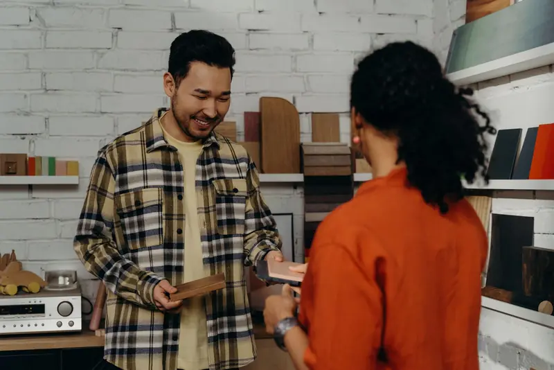Buyer choosing product samples with a supplier